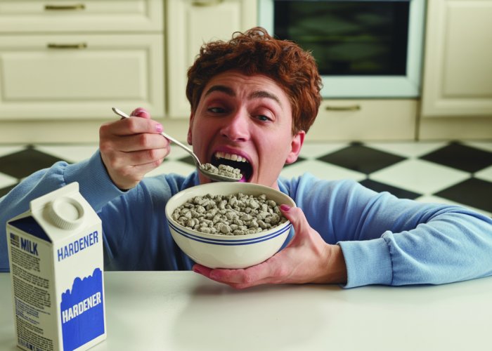 Person eating a bowl of cement cereal for breakfast.